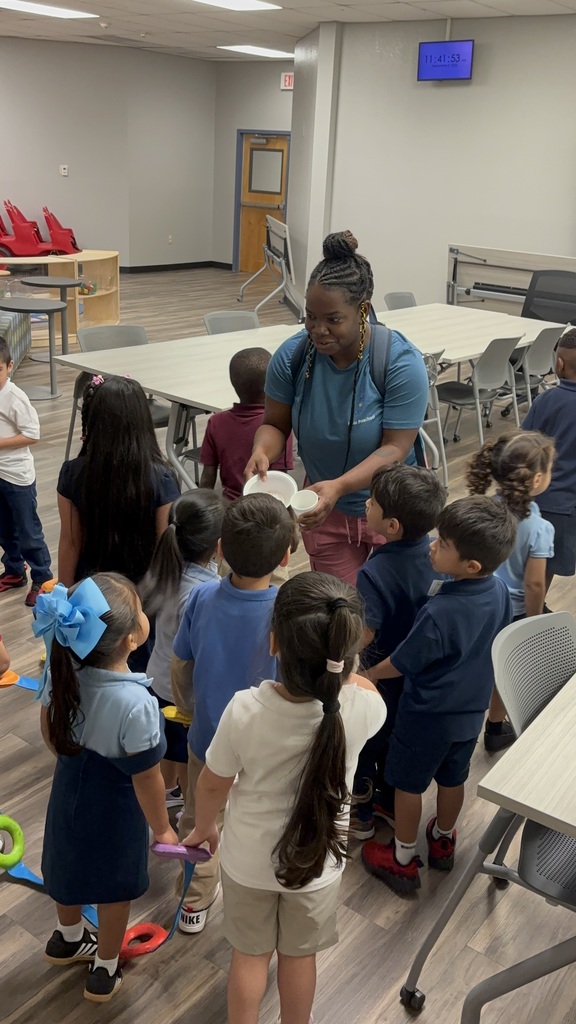 Teacher and kids participating in a scavenger hunt