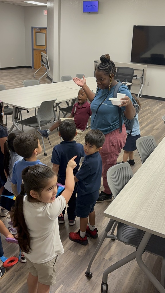 Teacher and kids participating in a scavenger hunt