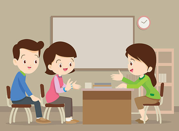 Cartoon dad and mom sitting across a teacher with a desk between them in a classroom