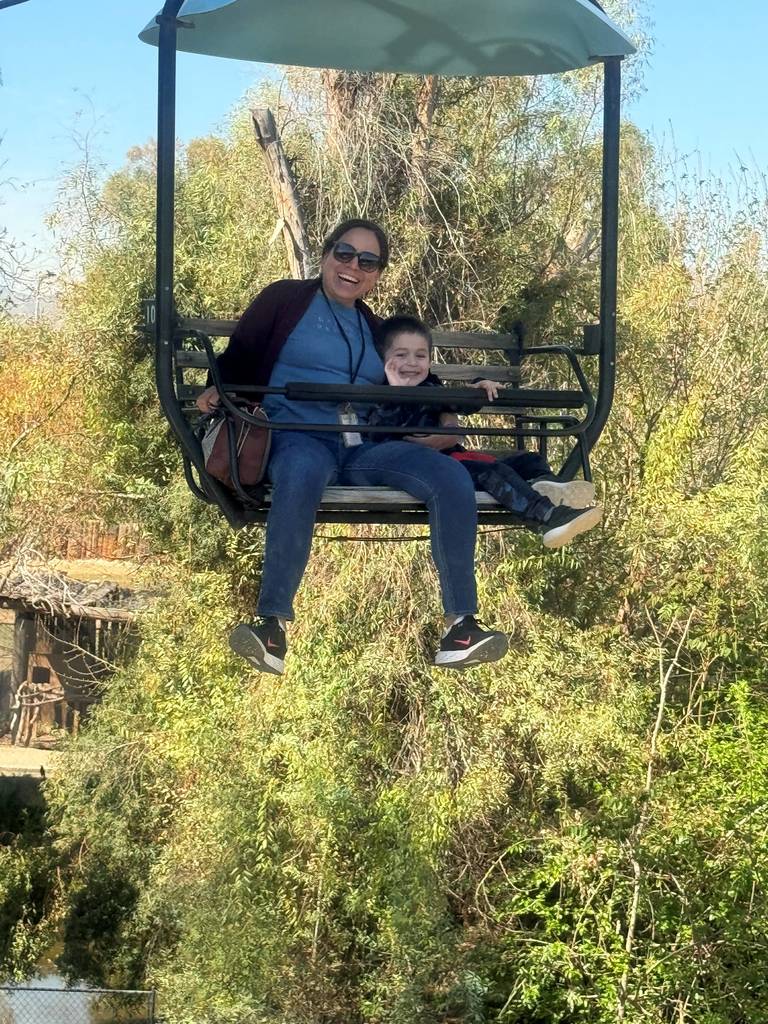 A mom and her son on the sky chairs