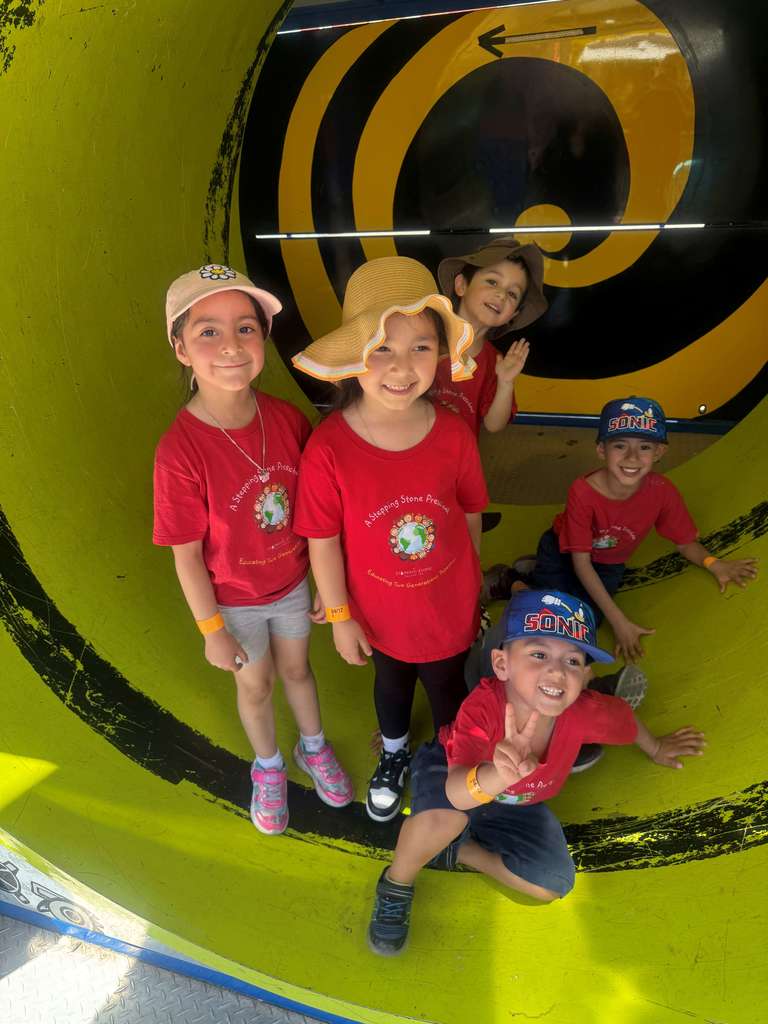 5 students in a tunnel in a funhouse