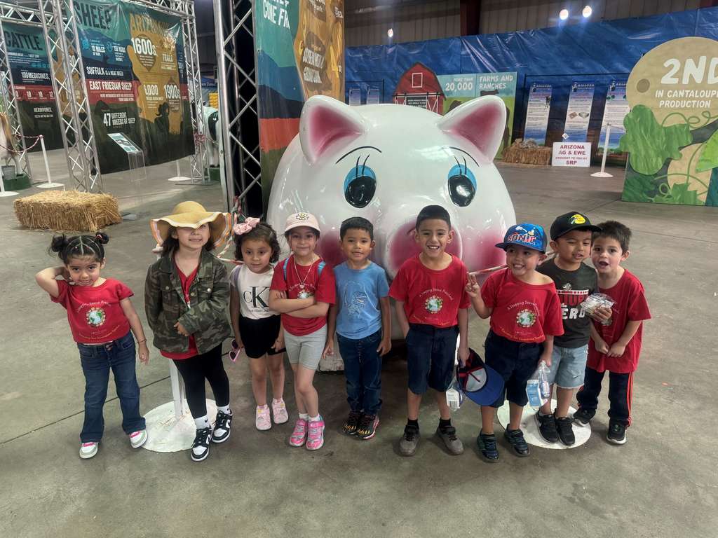 A Stepping Stone class in front of a giant pig