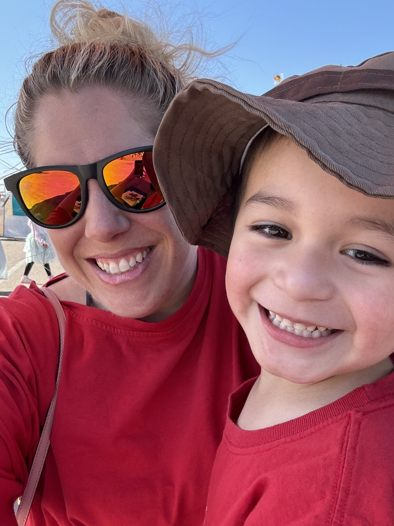 one student smiling in a selfie with his teacher