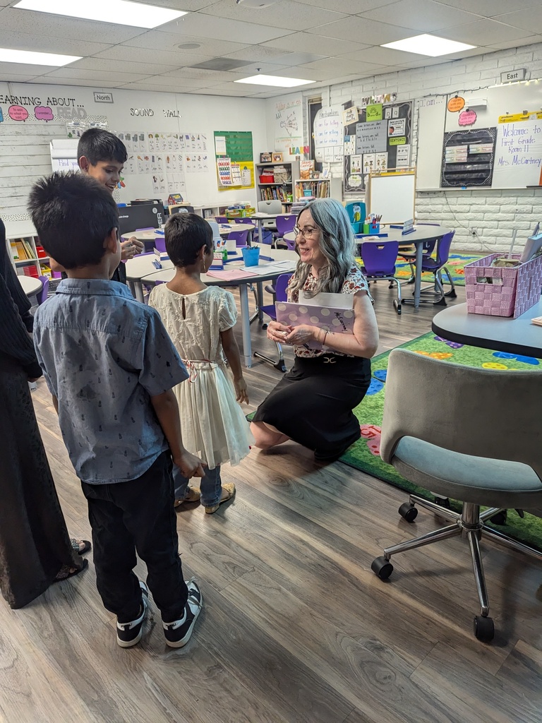 teacher talking with students