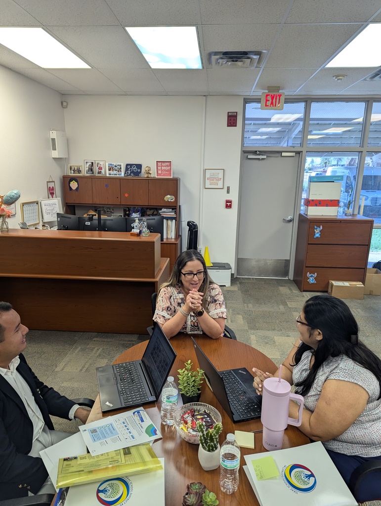 2 new isd staff members sitting at a table with HR specialist