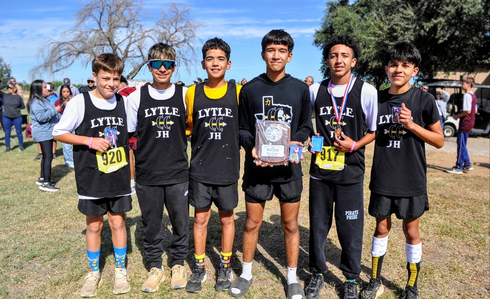 8th Grade Boys Cross Country Team with championship plaque