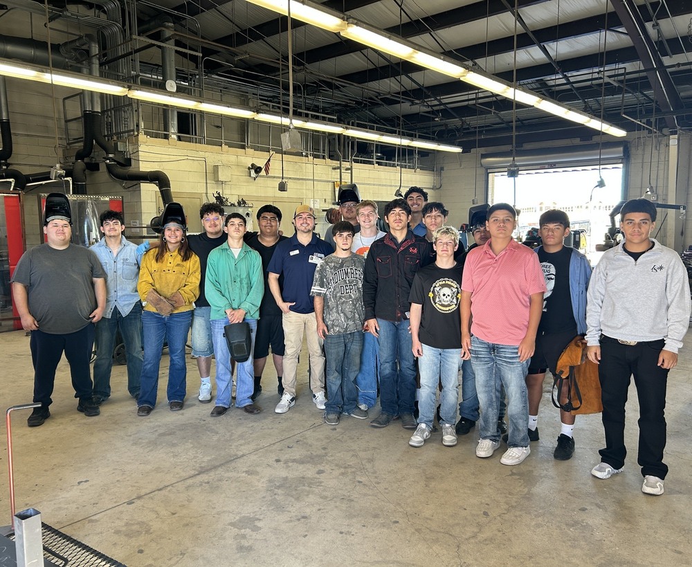 Welding students meet with a representative from UTI