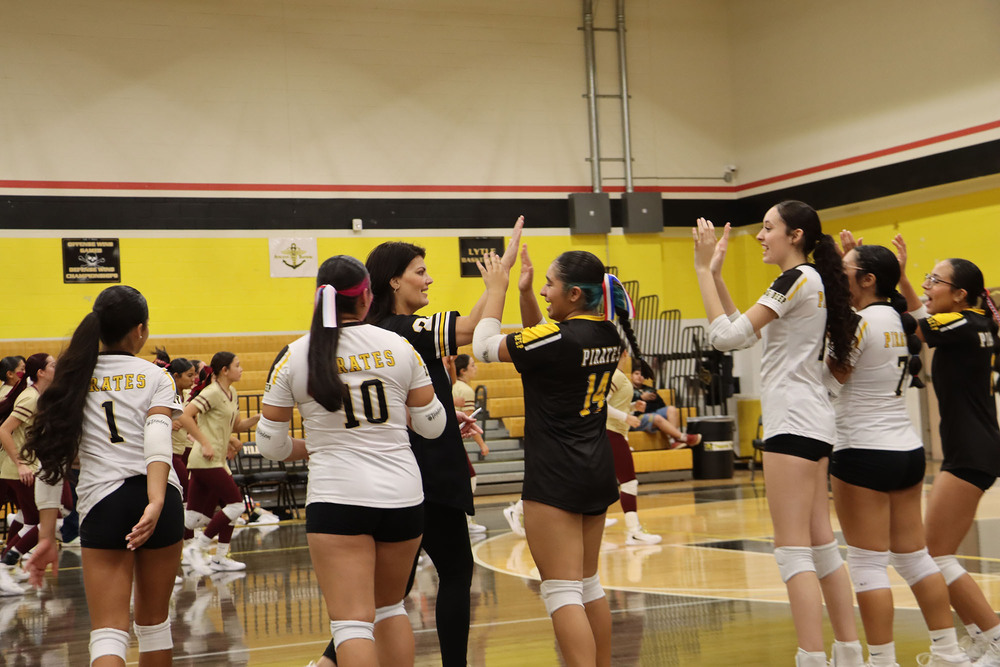 Volleyball team celebrating after win
