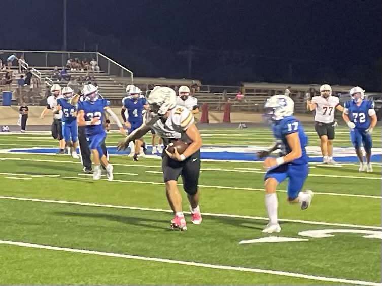 Pirate football player carrying the ball