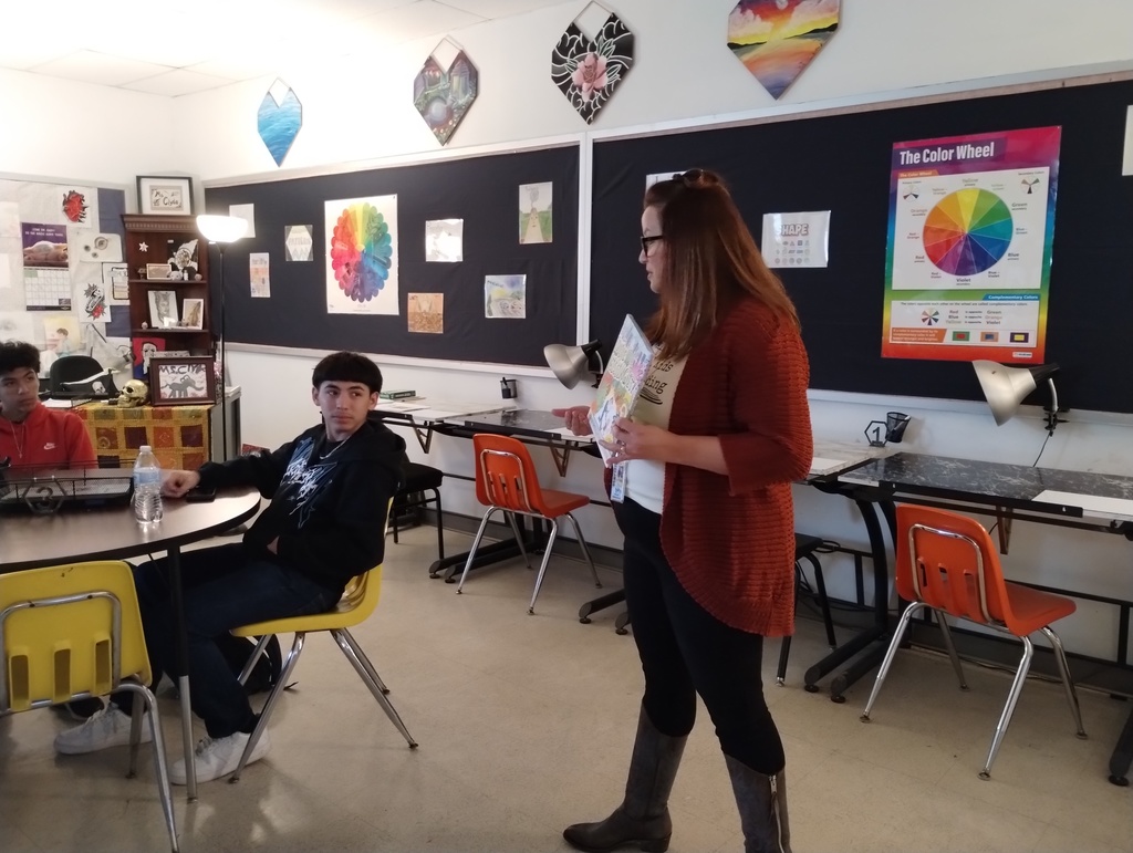 Dr Tanya Tate reading to the high school art class