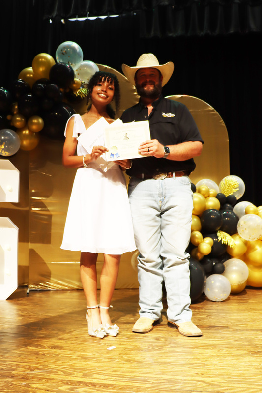John Phillip Sousa Award Recipient Nadia Daniels with Band Director Mr. Chessher