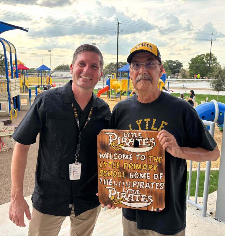 Superintendent Dustin Breithaupt with a community member who created a welcome sign for the Primary