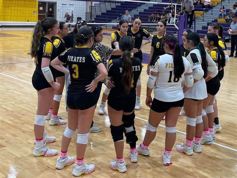 Coach Tilley talks to volleyball team