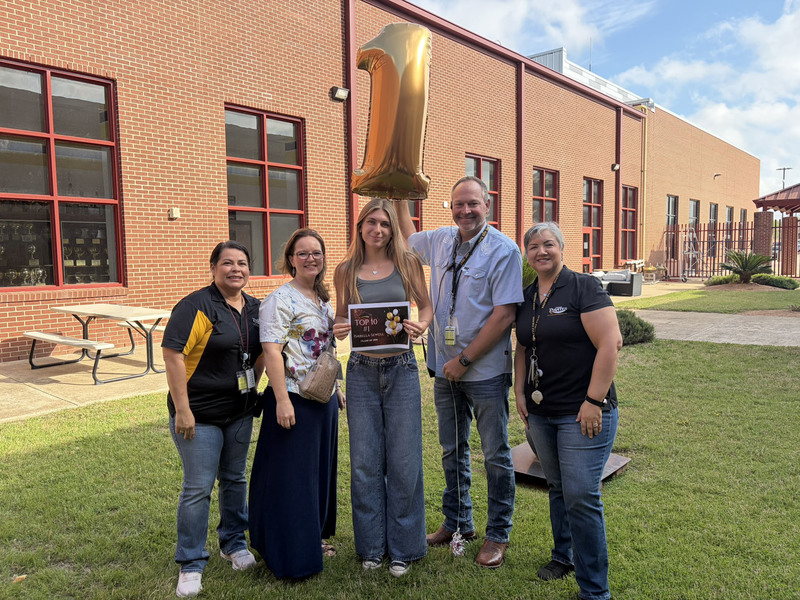 No 1-ranked senior Isabella Sewell with school administrators