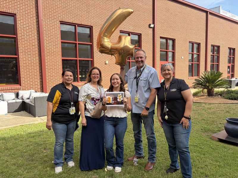 No 4-ranked senior Gabriela Cortez with school administrators