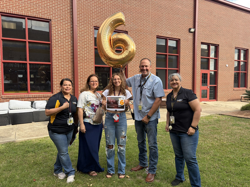 No 6-ranked senior Frances Scotello with school administrators