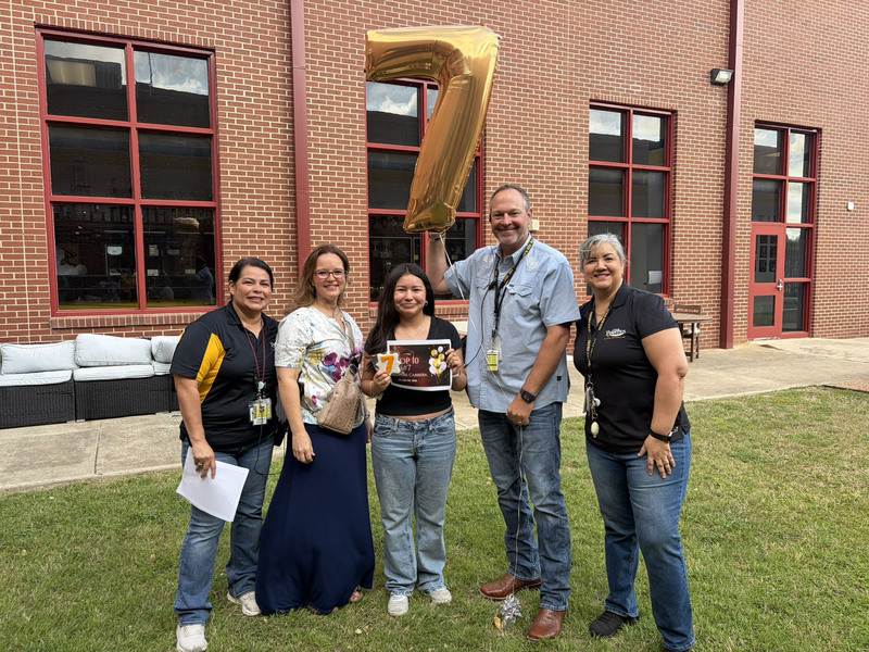 No 7-ranked senior Karyme Cabrera with school administrators