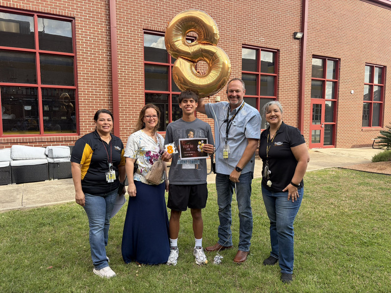 No 8-ranked senior Diego Reyna with school administrators