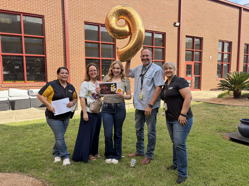 No 9-ranked senior Taryn McDonald with school administrators