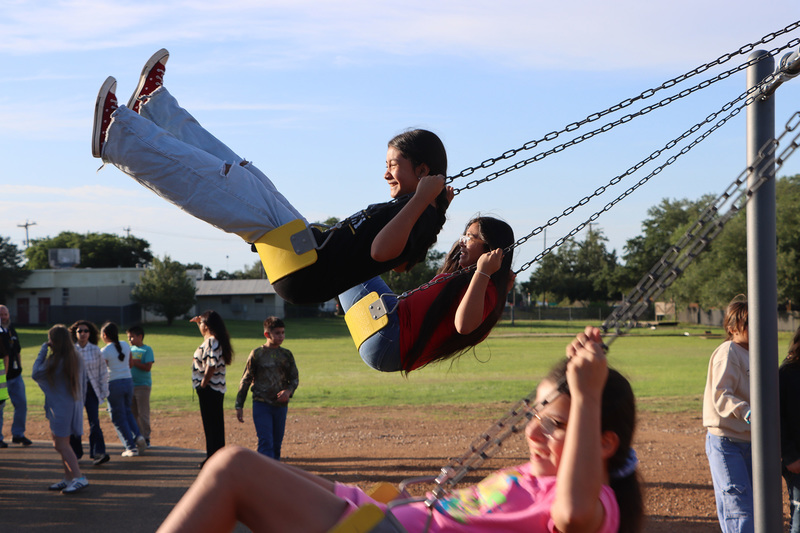 Fifth graders enjoy the new swings
