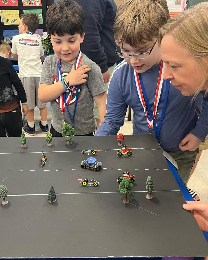 racers using magnets to move cars