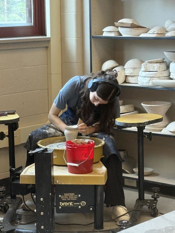 student listening to music while exploring curiosity