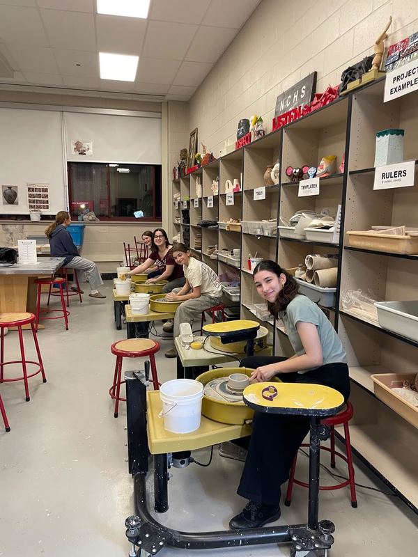 students smiling while exploring curiosity