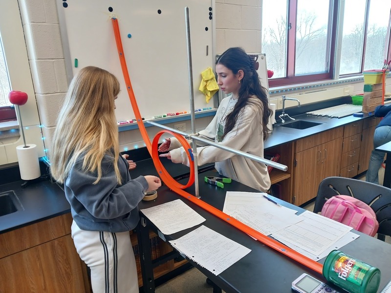 Physics students working on lab