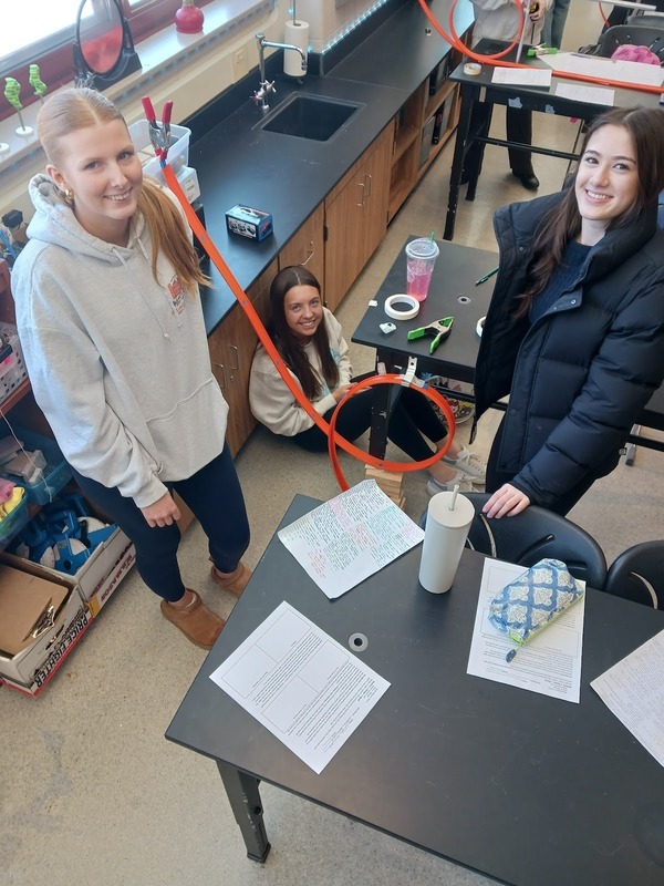 Physics students working on lab