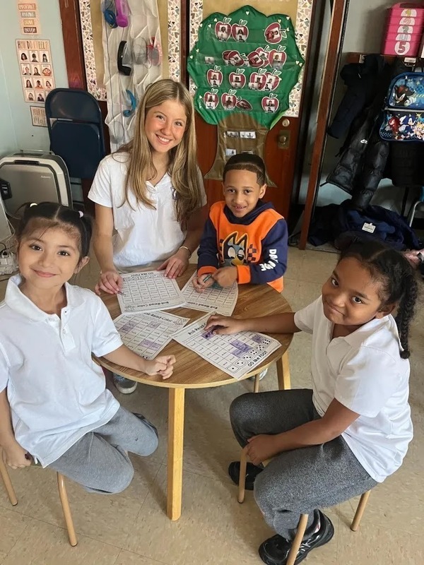 NHS student with the kids