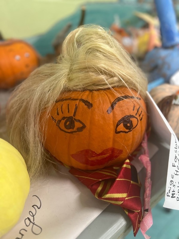 Pumpkin with a face and a wig Pumpkin with a face and a wig