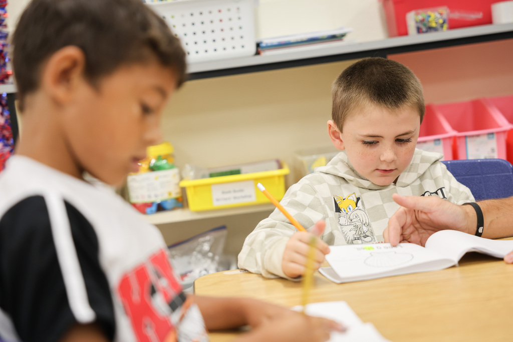 Students working at the Summer Reading Camp at Carlisle-Foster's Grove Elementary School