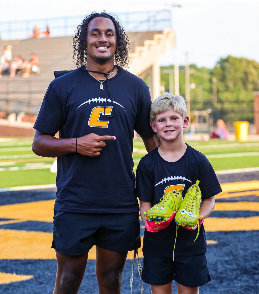 Chesnee High QB Evan-Reece Lawter gives a special set of cleats to one of his biggest fans. 