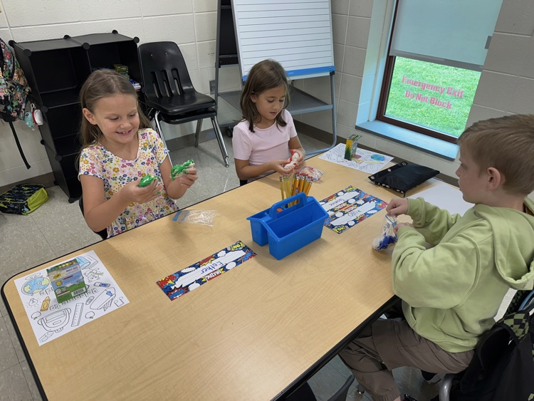 Student playing with clay.