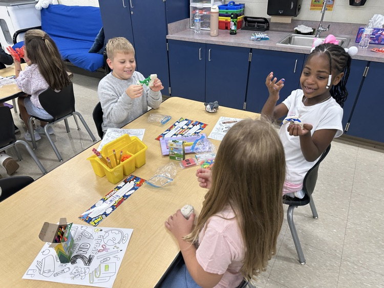 Student playing with clay.