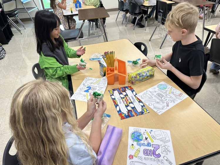 Student playing with clay.