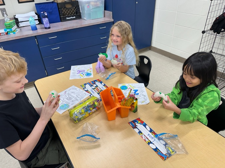Student playing with clay.
