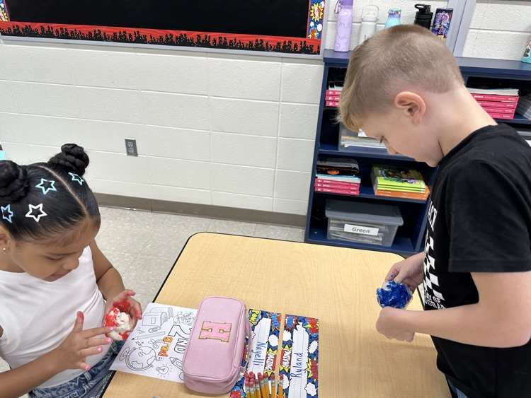 Student playing with clay.