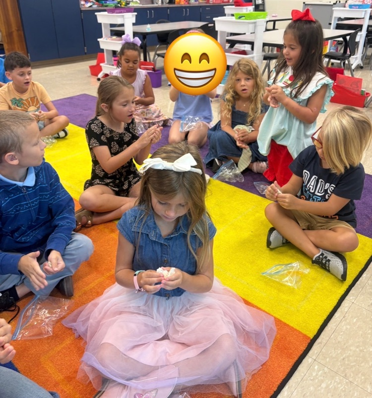Students play with clay.