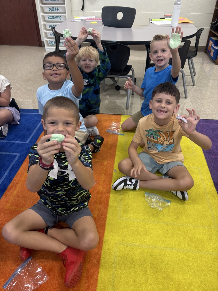 Students play with clay.