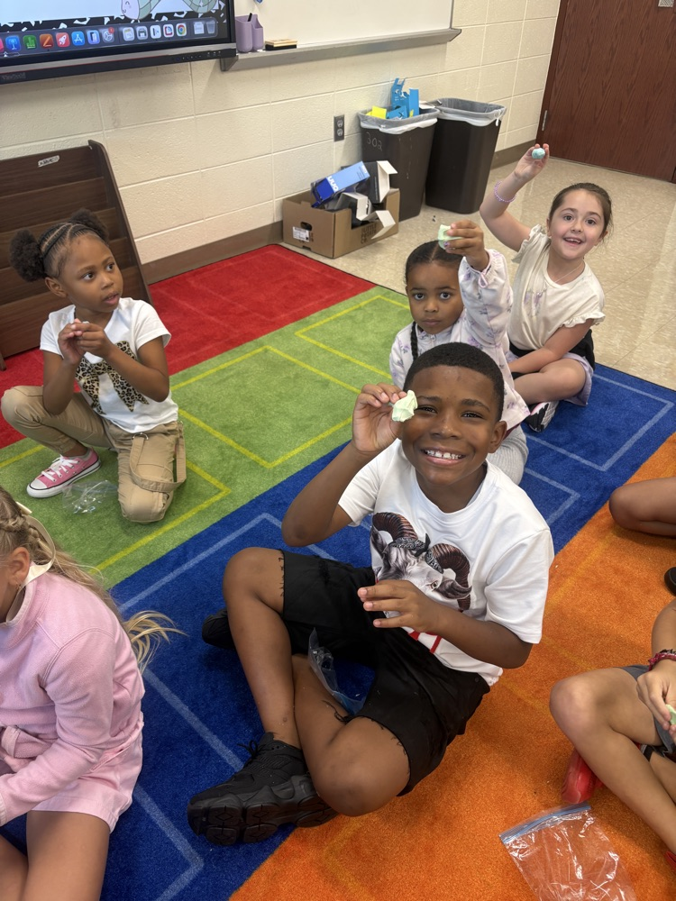 Students play with clay.