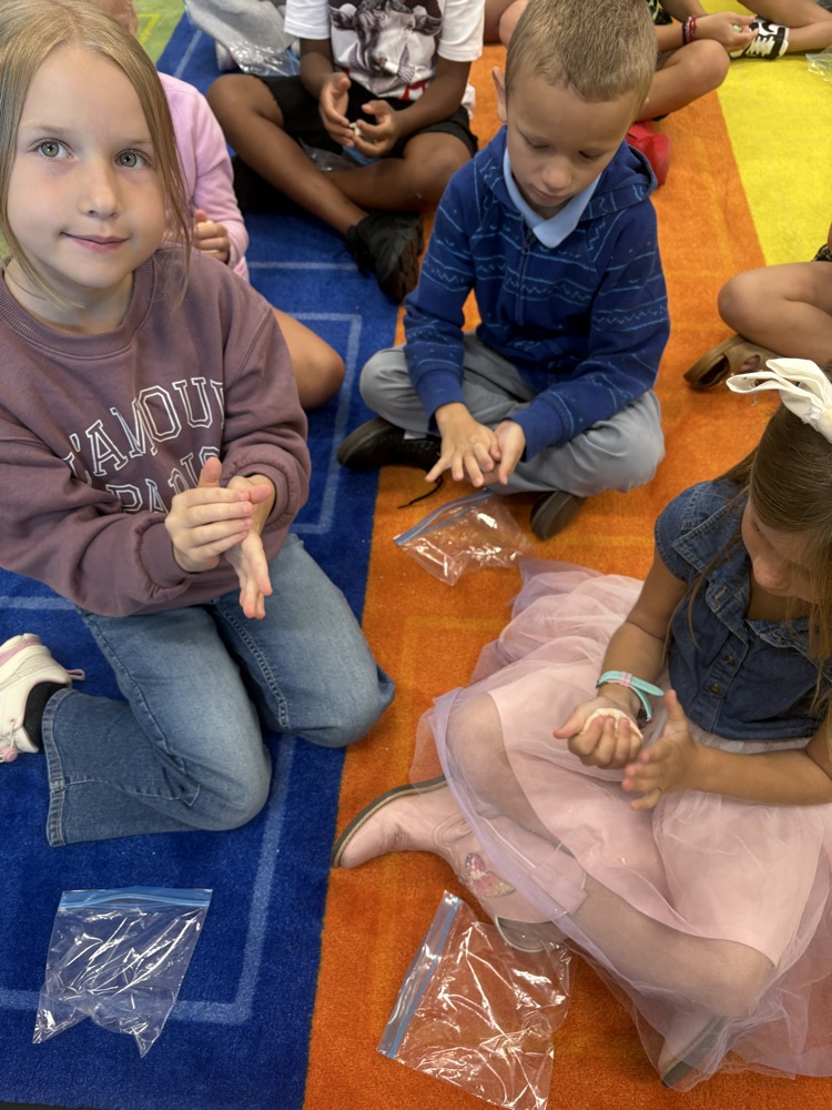 Students play with clay.