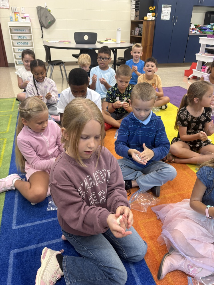 Students play with clay.