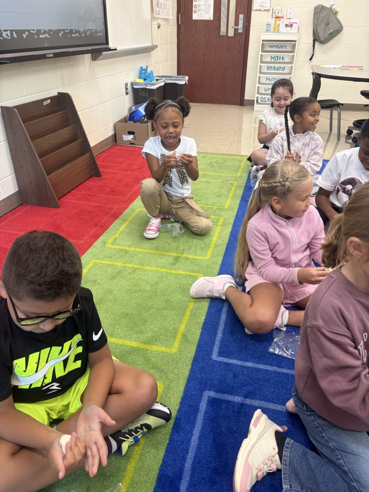 Students play with clay.