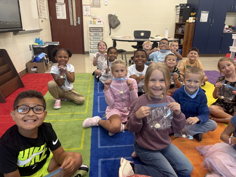 Students play with clay.