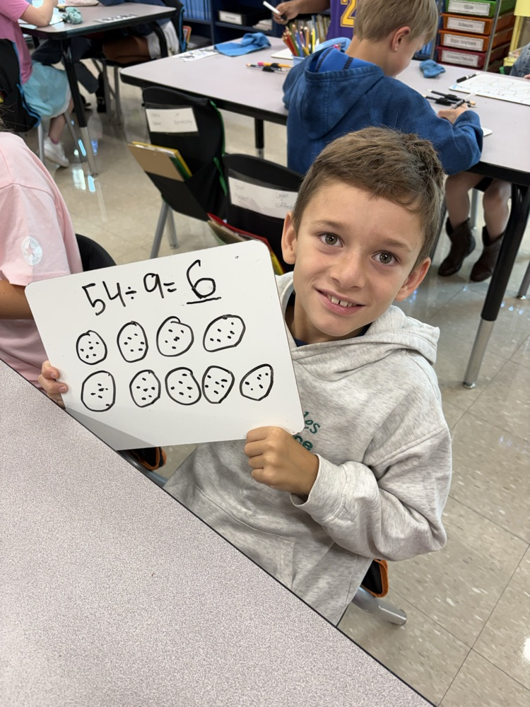 Boy working on multiplication.