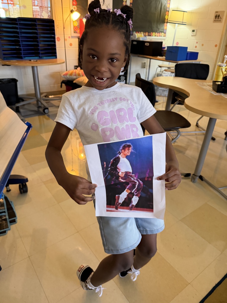 First grade students showing off their "Me" bags! 