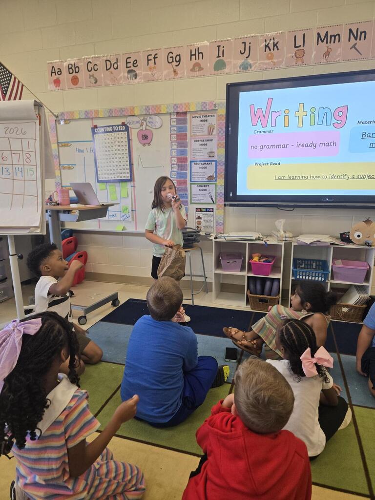 First grade shares their "Me" bag. 