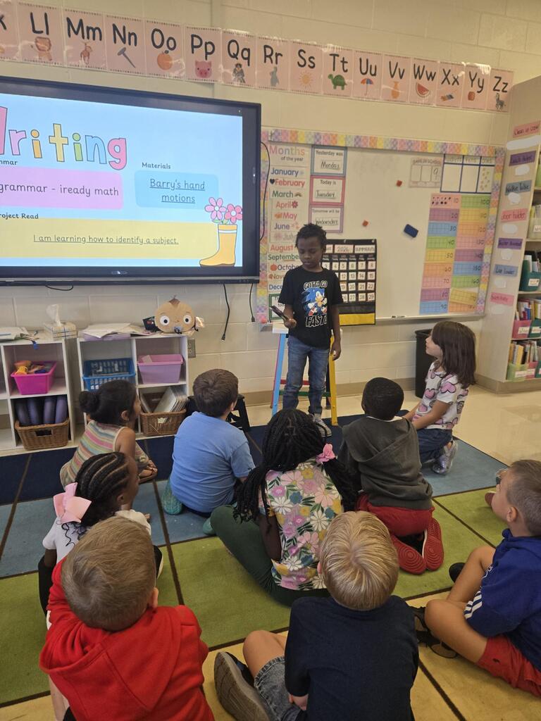 First grade shares their "Me" bag. 