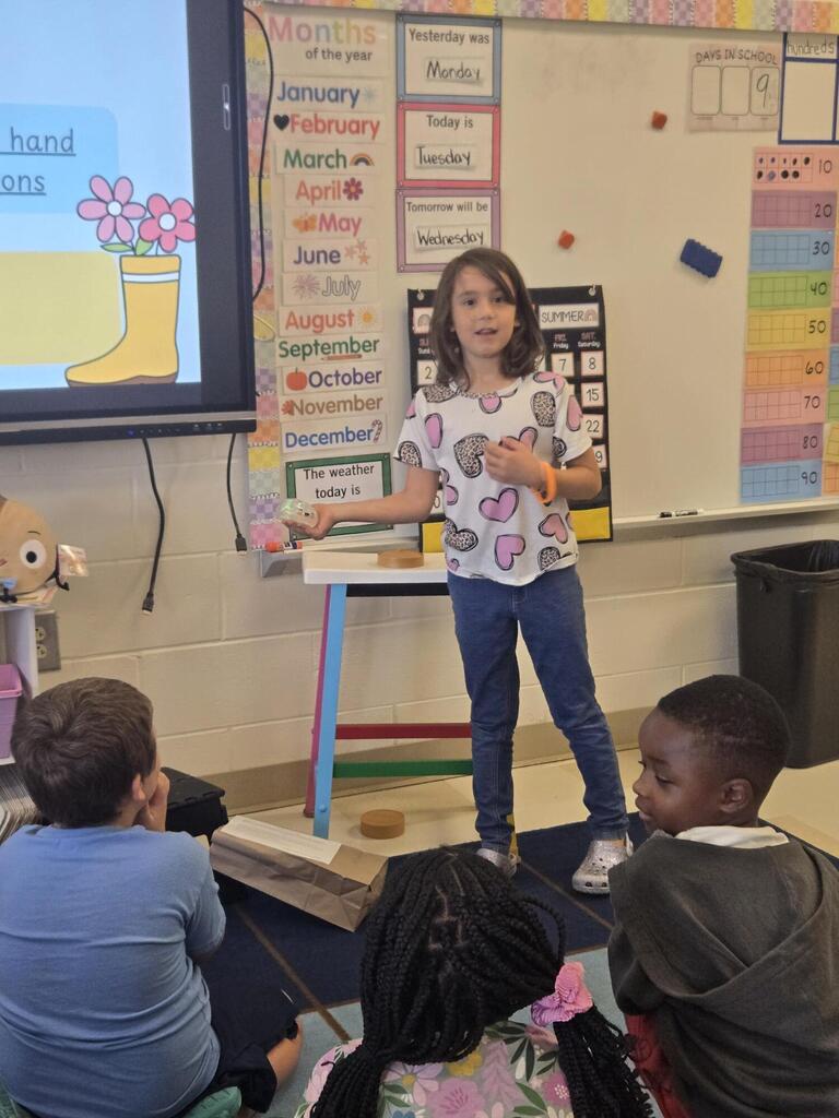 First grade shares their "Me" bag. 
